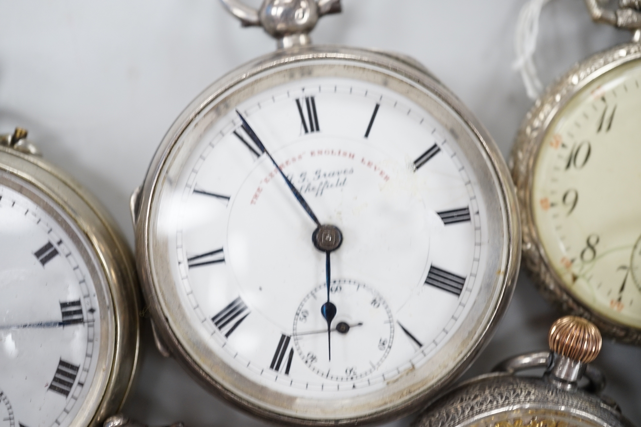 Thirteen assorted pocket and fob watches including silver Exchange and silver J.W. Benson.